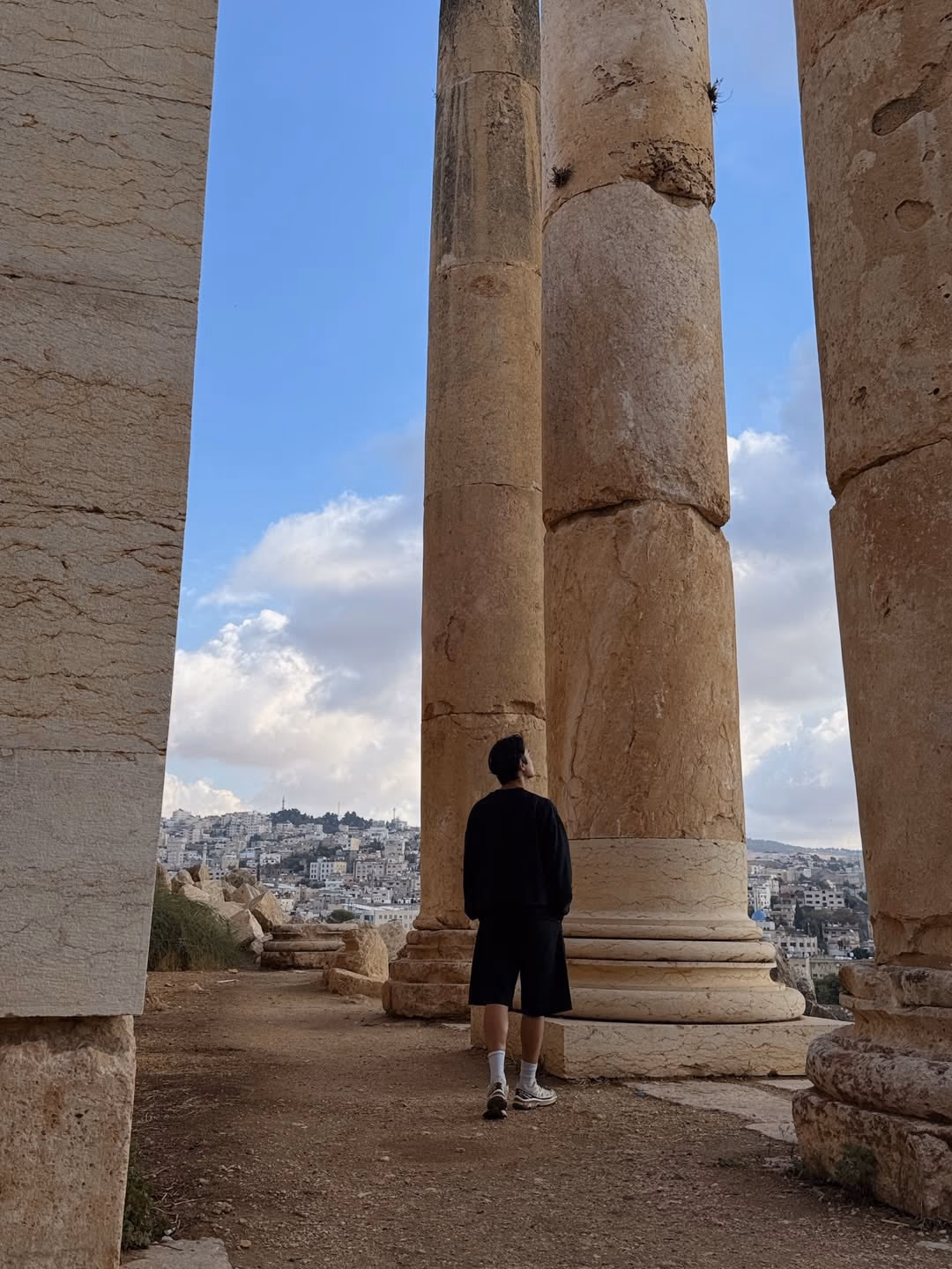 Hiker walking through Dana Biosphere Reserve canyon landscape Jordan